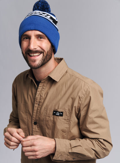 IDEA REGALO - CAPPELLINO IN LANA BLU CON POMPON ORIGINALE STIHL